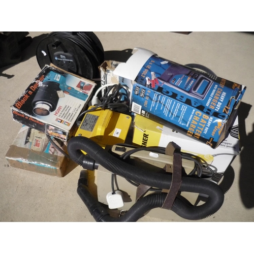 96 - Various tools and electrical cables including a large angle grinder, car vacuum and a heavy duty bat... 