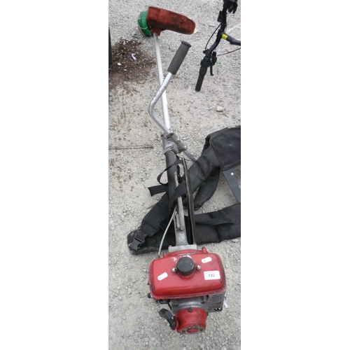 192 - Tando Pro 850 petrol strimmer with harness