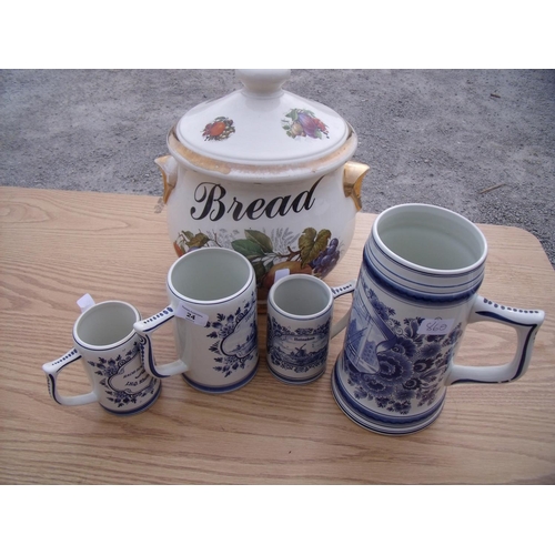 24 - Four blue & white Delft style Dutch tankards and a large Staffordshire twin handle bread pot (5)