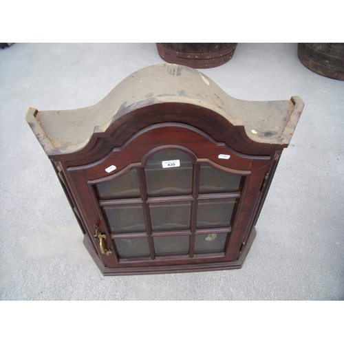 435 - Modern mahogany arch top wall cabinet enclosed by single glazed door (width 68cm)