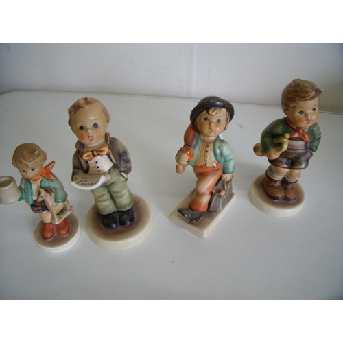 71 - Group of four various Hummel/Goebel figures of boys