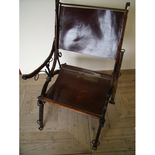 469 - Unusual and unique leather and metal framed armchair, the supports made from horses harness hames