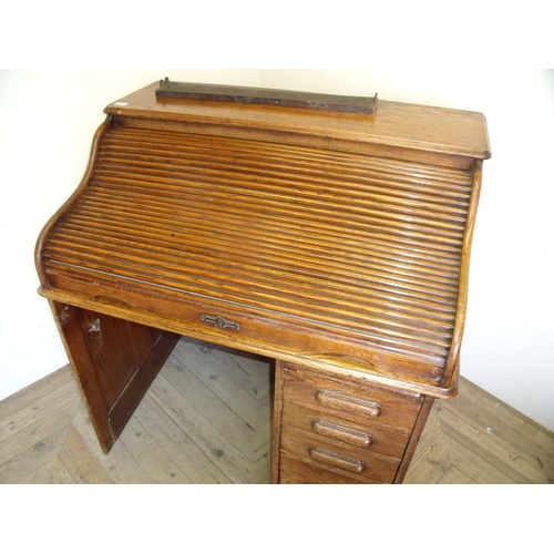 477 - Edwardian oak single pedestal roll-top desk (width 105cm)