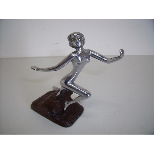 9 - Circa 1920 chrome figure of a nude lady mounted on a carved base (height 12cm)
