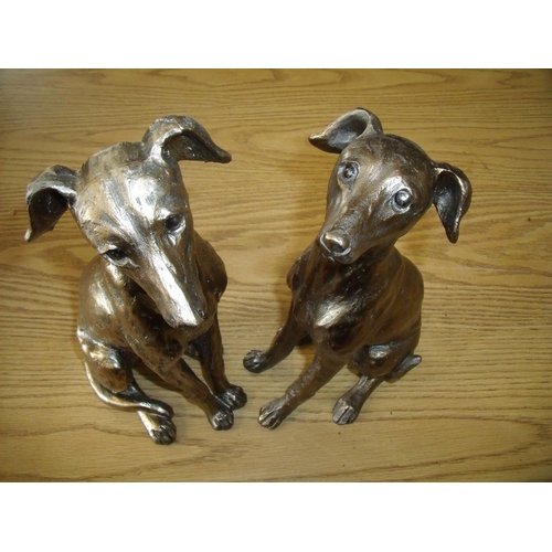 7 - Pair of gilt composite figures of seated Lurcher type dogs (30cm high)