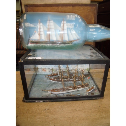 65 - Glazed and cased display of model sailing ships (27cm x 19cm x 14cm) and a triple masted ship in bot... 