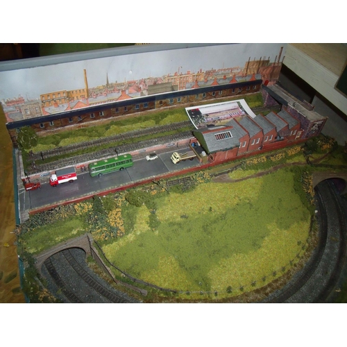 111 - N gauge model railway layout with track scenery, buildings and accessories