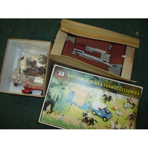 299 - Selection of model buildings, Britains farm animals, Britains boxed riding accessories set and a Din... 