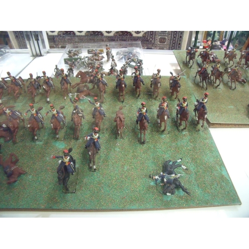 336 - Quantity of painted cast metal military miniatures including infantry, cavalry etc including mounted... 