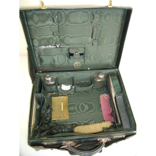 99 - Finnegan's leather travelling vanity case with fitted interior and a selection of silver hallmarked ... 