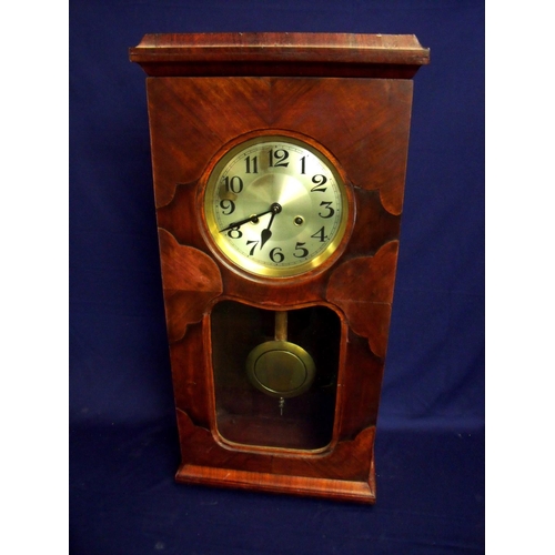 105 - Early 20th C walnut cased wall clock with steel face and chiming movements enclosed by a glazed door... 