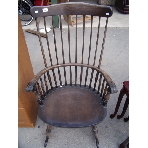 261 - Stick back rocking chair with scroll detail arms