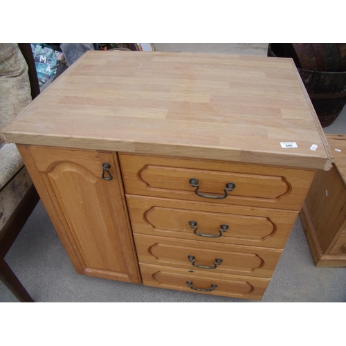 388 - Small kitchen style cabinet with a single cupboard and four drawers