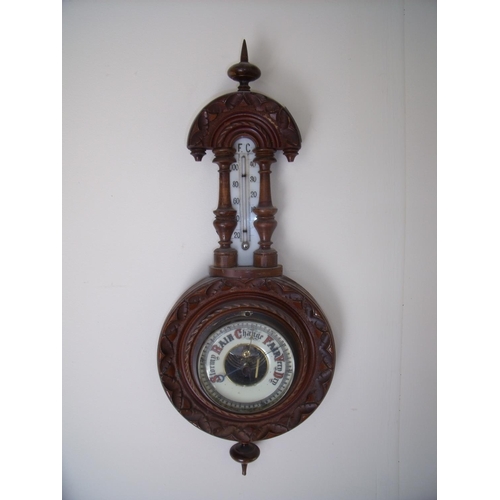 122 - Small carved beech framed aneroid wall barometer with milk glass thermometer plate (overall length 4... 