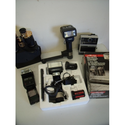 13 - Box of various flash guns, binoculars and cine equipment including a boxed Metz 45 CT4 flash gun