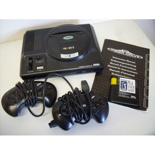 18 - Sega Mega Drive games console including instructions, two controllers and a copy of PGA Tour Golf