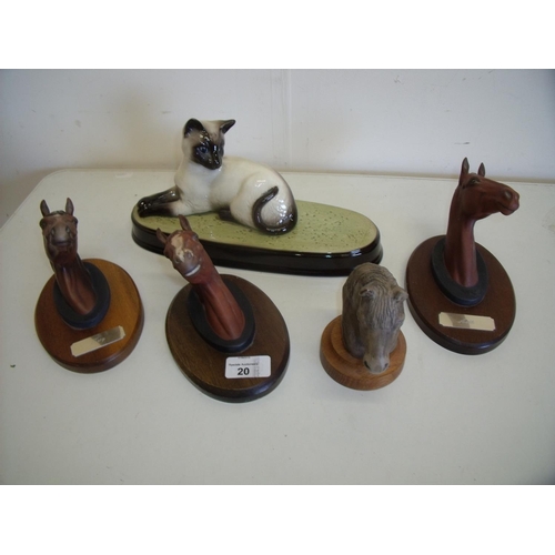 20 - Three Beswick horse heads on wooden plinths No 2699, 2700 and 2702, a Beswick Siamese cat on plinth ... 