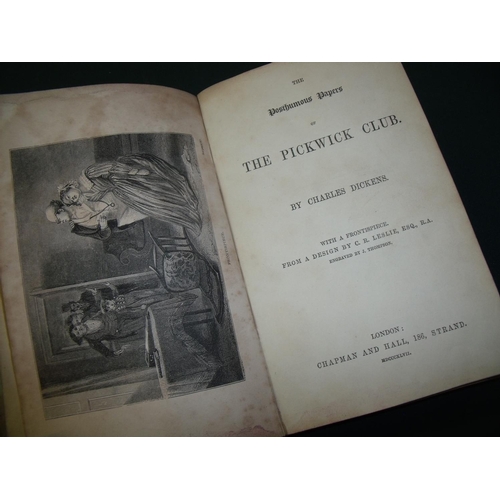 235 - Copy of 'The Posthumous Papers of the Pickwick Club' by Charles Dickens dated 1847, in marbled effec... 