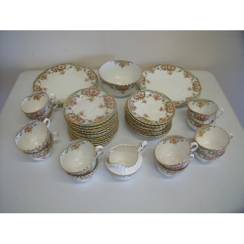 25 - Forty piece Hughes Fenton floral pattern tea service, 12 cups and saucers, 12 tea plates, 2 sandwich... 