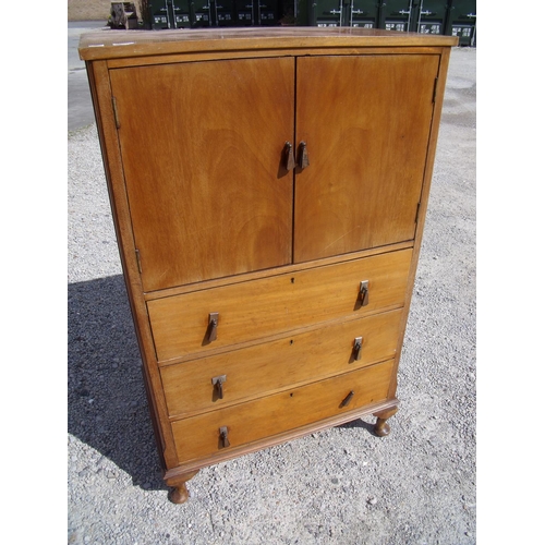 276 - Early-mid 20th C mahogany tallboy with two cupboards and internal slide tray above three drawers, on... 