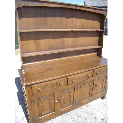 324 - Old Charm style dresser of three drawers above four cupboard doors and plate rack (153cm x 43cm x 16... 