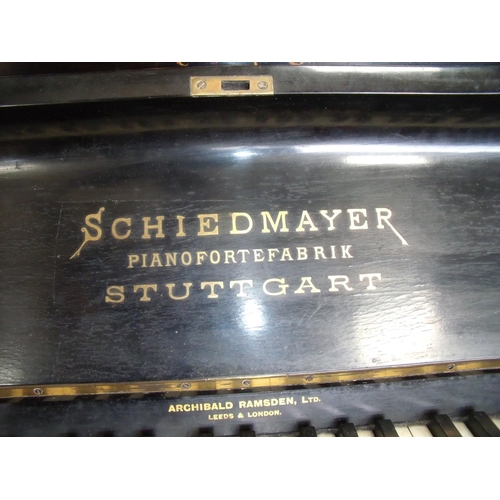 340 - Ebonised upright piano by Schiedmayer, retailed by Archibald Ramsden