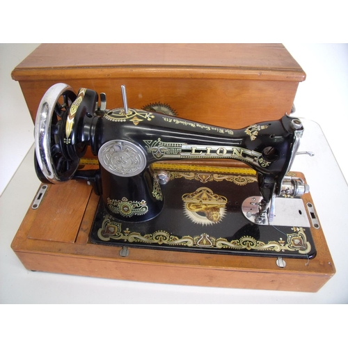 86 - Rare Lion vintage sewing machine in lightwood case