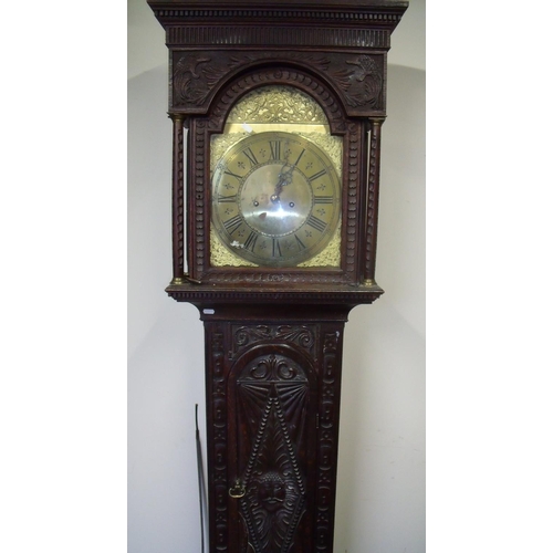 122 - Heavy carved oak cased 8 day brass faced long case clock