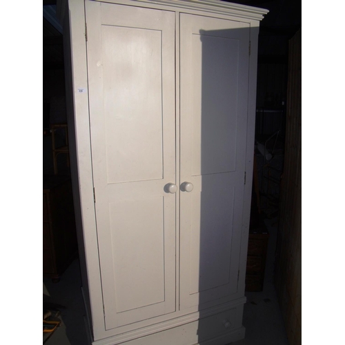 393 - Cream painted pine double door wardrobe with single drawer to the base (105cm x 57cm x 215cm)