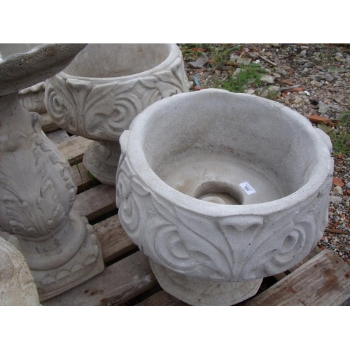 102 - Two Fleur de Lys urns depicting a stylized three petal design