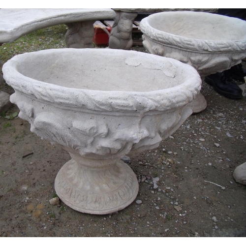 105 - Two large urns decorated with acanthus leaves