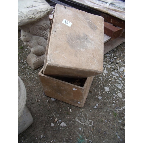 109 - Two cubed terracotta planters