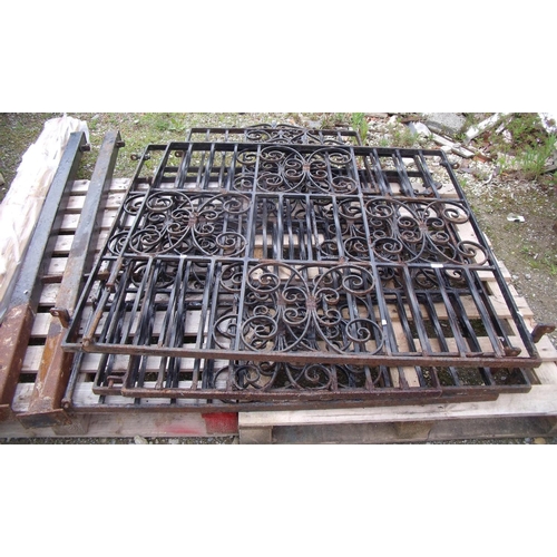 112 - Two sets of ornate cast iron garden gates with two posts