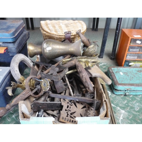 26 - A box containing various metal items including fire tongs, fire dogs, some brass pieces, some brass ... 