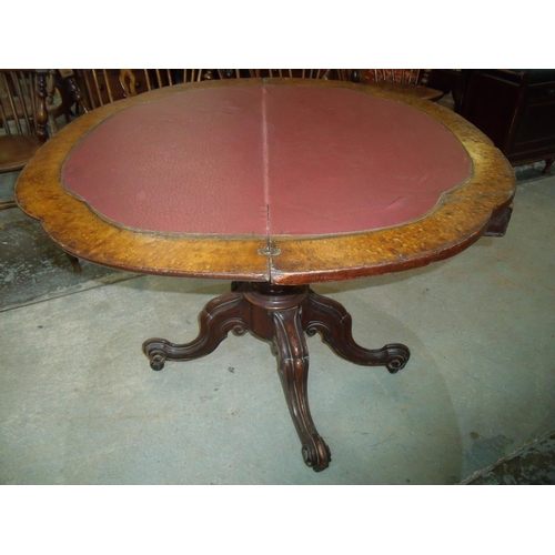 285 - Victorian mahogany fold over table on bulbous column and four out-splayed supports (width 90cm)