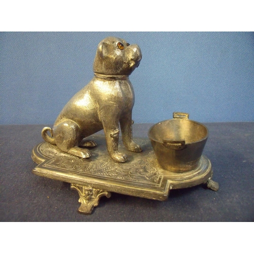 166 - Unusual silver plated figure of a seated pug dog with glass eyes mounted on raised base, with twin h... 