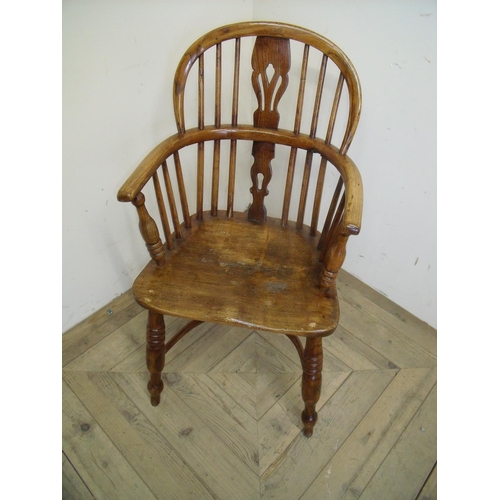 269 - Elm child's Windsor stickback armchair with crinoline understretcher and turned supports