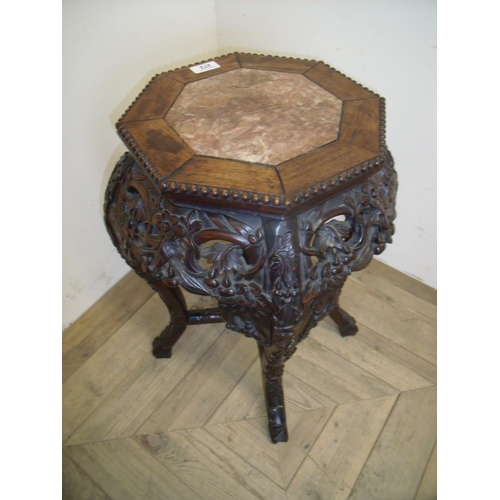 272 - Carved Chinese hardwood octagonal jardiniere stand with inset marble panel, with X shaped understret... 