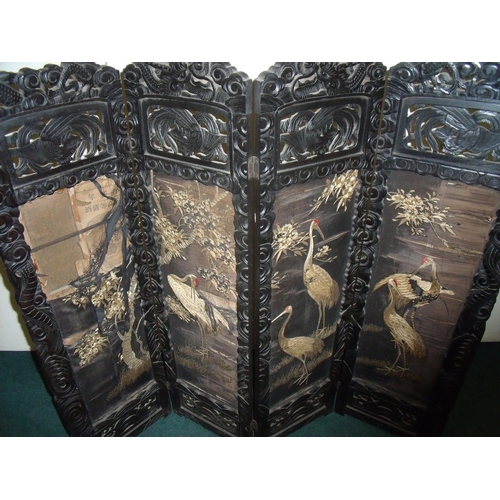 278 - Early 20th C carved Chinese hardwood four sectional screen with silk work panels depicting cranes an... 