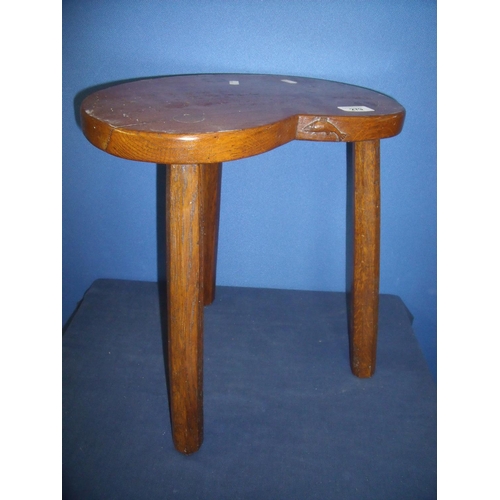 279 - Yorkshire oak kidney shaped three legged 'Troutman' stool (height 40cm)