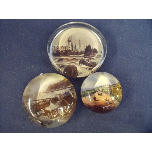 28 - Set of three souvenir glass paperweights depicting Scarborough and Filey