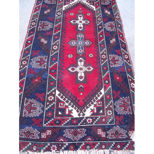 301 - Red and blue ground Persian pattern rectangular rug 216cm x 119cm