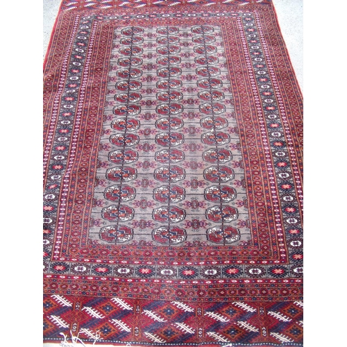 302 - Red ground rectangular Persian pattern rug 203cm x 129cm