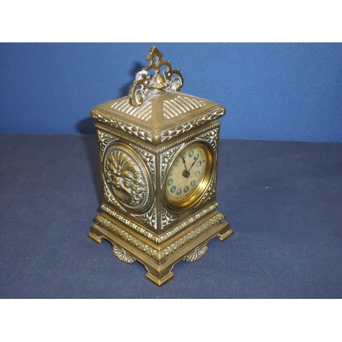 104 - Early 20th C cast brass cased mantle clock with painted movement, manufactured by The British United... 
