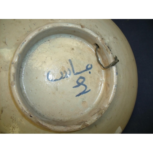 11 - 19th C Iznik style tin glazed shallow dish on raised base (diameter 29cm) the underside with blue si... 