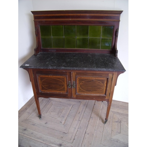 235 - Edwardian mahogany inlaid washstand with raised tile back above marble top and two panelled cupboard... 