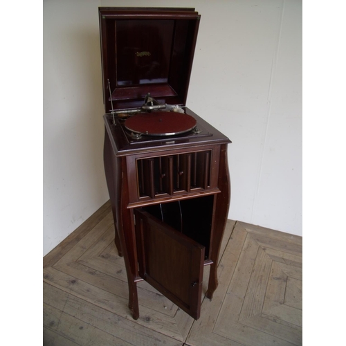 243 - Mahogany cased Dulcetto Gramophone with record cupboard to the base (44cm x 50cm x 107cm)