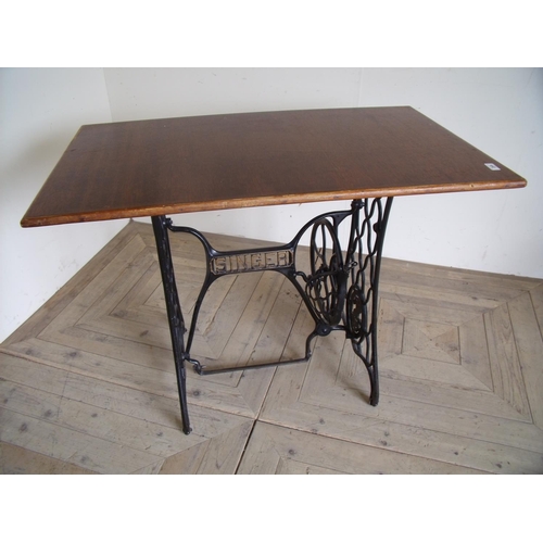 259 - Rectangular top cafe style table with cast metal Singer sewing machine base (103cm x 61cm x 75cm)