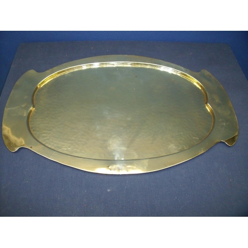 36 - Art Nouveau oval brass tray, the central panel with hammered detail (51cm x 32cm)