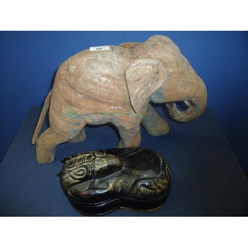 64 - Carved wood pine style elephant with traces of painted detail (29cm high) and a lacquered kidney sha... 